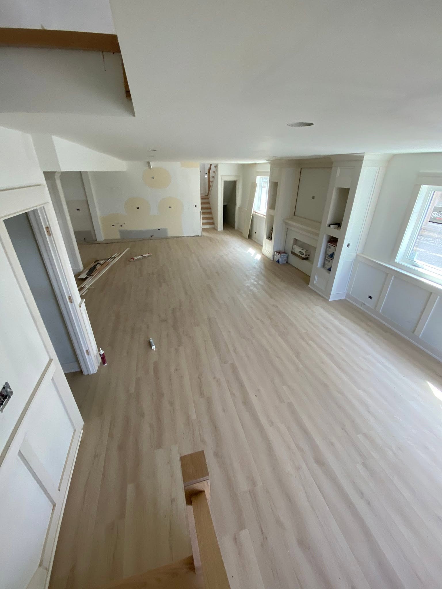 Engineered hardwood flooring installed in an open-concept room