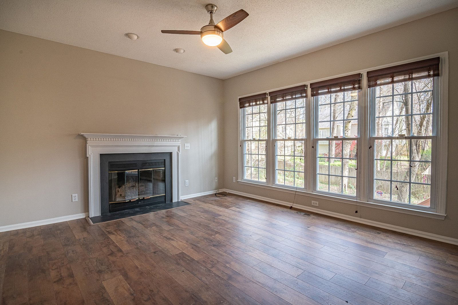 Elegant living room with hardwood flooring and a fireplace