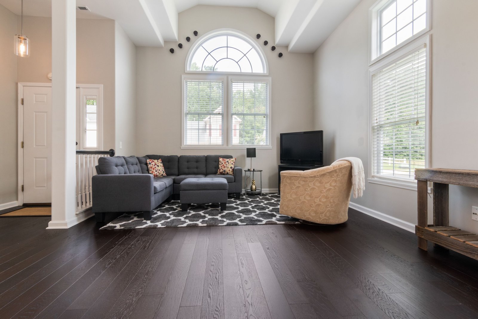 Furnished living room with new hardwood flooring